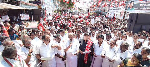 திருப்பரங்குன்றத்தில் நடந்த ஆர்ப்பாட்டத்தில் ராஜன் செல்லப்பா எம்.எல்.ஏ. பேசினார். அருகில் நடிகை விந்தியா உள்பட பலர் உள்ளனர். 