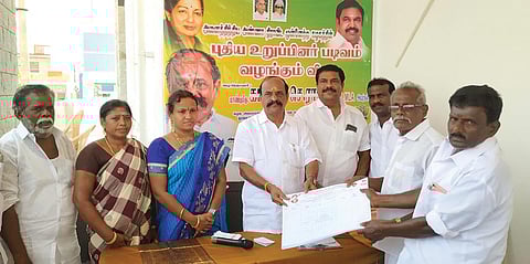 கோவில்பட்டியில் அ.தி.மு.க. புதிய உறுப்பினர் சேர்க்கை படிவங்களை கடம்பூர் ராஜூ எம்.எல்.ஏ. வழங்கிய போது எடுத்தபடம்.