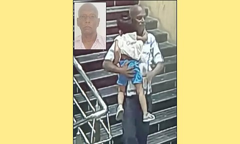 குழந்தையை தூக்கிச்செல்லும் ராஜேந்திரன்.