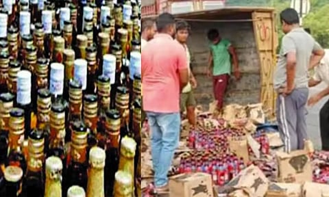 மதுபானம் ஏற்றி வந்த லாரி கவிழ்ந்து விபத்து- மது பாட்டில்களை போட்டி போட்டு அள்ளிச் சென்ற பொதுமக்கள்