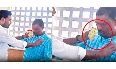 லஞ்சம் கேட்ட அதிகாரிக்கு பண மாலை அணிவித்து போராட்டம்