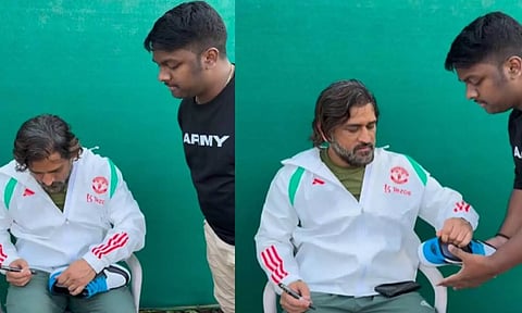 ரசிகரின் 'ஷூ'வில் கையொப்பமிட்ட டோனி- வைரலாகும் வீடியோ