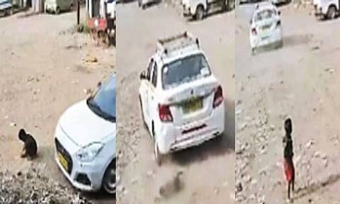 விளையாடிக் கொண்டிருந்தவன் மீது ஏறி இறங்கிய கார்- அதிர்ஷ்டவசமாக உயிர் பிழைத்த சிறுவன்