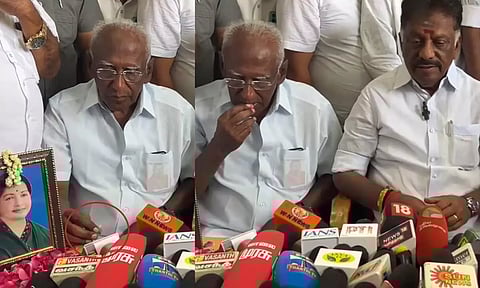 ஓ.பன்னீர்செல்வம் பேட்டியளித்தபோது ரோஜா பூவை சாப்பிட்ட ஆதரவாளர்