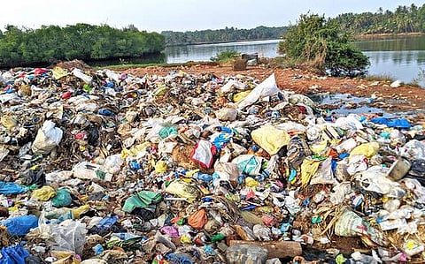 Solid waste from Padubidri Gram Panchayat limits found dumped on the northern bank of the Shambhavi in Hejmadi village in Udupi district.