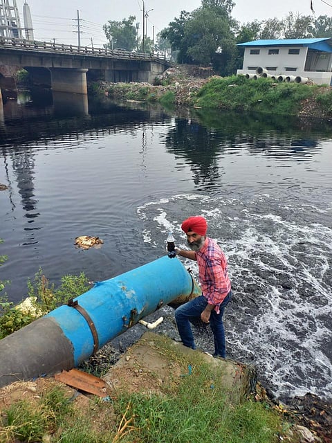Sample of 'treated' water being collected from an outlet of a CETP in Ludhiana.