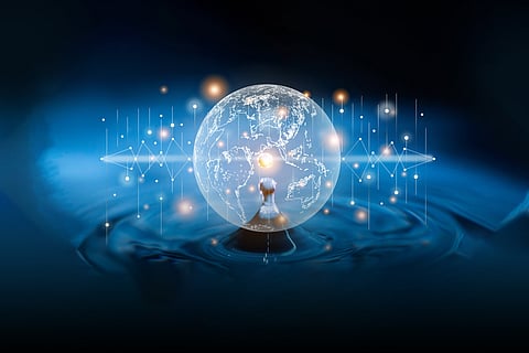 A conceptual digital illustration showing a glowing, translucent globe suspended above a water droplet creating ripples. Overlaying the globe are various data points, interconnected white lines, and pulse-like wave patterns in a deep blue, futuristic aesthetic, symbolizing the use of artificial intelligence and real-time data in global water management.