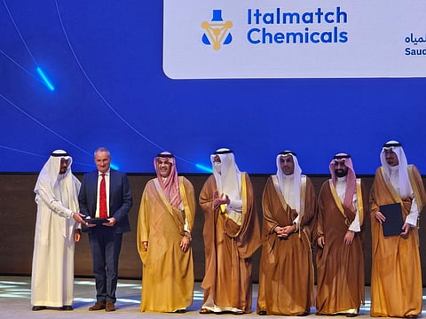 Group of officials and company representatives on stage during the Italmatch Chemicals and Saudi Water Authority agreement-signing ceremony in Riyadh.
