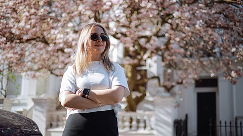 Model wearing spring 2026 fashion: Broderie blouse representing budget-friendly trends