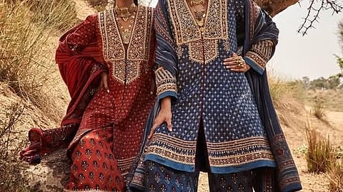 Women wearing Ajrakh kurta sets.