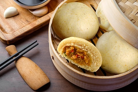 Chinese breakfast. Steamed buns and porridge are on the table