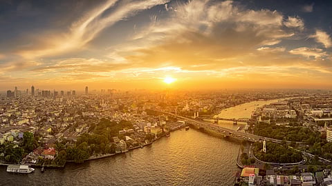 Bangkok Thailand panorama and skyscraper in center of Bangkok city. Modern buildings condominium at Chaophraya river with Bangkok cityscape under twilight sky