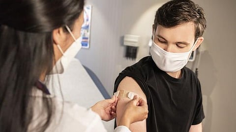 Being vaccinated with at least two doses of Pfizer vaccines dramatically reduces most of the long-term symptoms individuals reported months after contracting COVID-19, a new study shows (CDC)