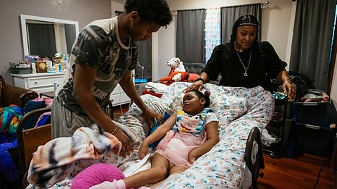 Rhonda Jones with son Tyrus and daughter Alayna at their home in Crown Point, Indiana. Alayna was injured during her birth and has cerebral palsy. She was recently hospitalized with respiratory syncytial virus, or RSV.