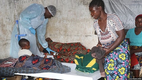 Medical staff takes care of a cholera patient inside a cholera ward in Blantyre, Malawi