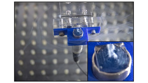 An ultrasound apparatus arranges gas vesicles into the shape of the letter R in solution.