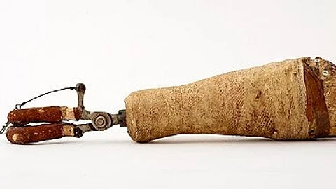 A hollow, fiberglass prosthetic arm with attached pincher hooks and a rubber grip.