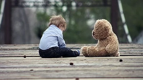 By investing in services early in life for babies showing early autism signs – and thereby reducing levels of disability