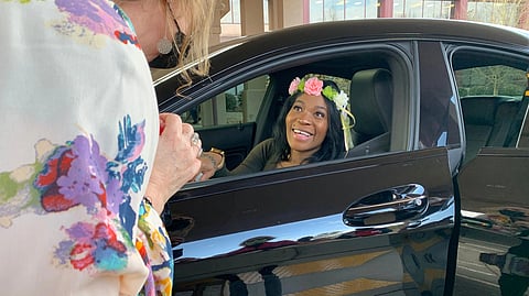 A pregnant military veteran receives a tiara at a drive
-
thru baby shower run by the Atlanta VA Clinic.
"We are very well aware of the maternal mortality statistics, which are terrible in the Southeast and
impact Georgia in very high numbers," says Kathleen
O'Loughlin