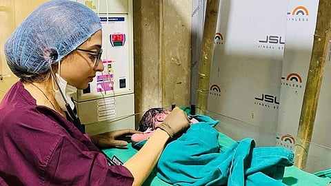 Dr. Sushanta examining an infant at her clinic.