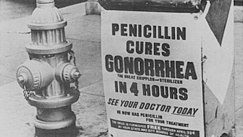 A poster attached to a curbside mailbox offering advice to World War II servicemen (Wikimedia Commons)