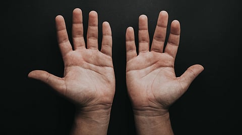 Dr. Sudhir states in his tweet that the salient observations are that the patient experienced shaking hands only when he engaged in activities, such as holding an object or attempting to write, with no tremors at rest. (representational image: Unsplash)