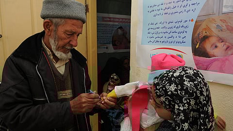 A health worker marks a child's finger with ink after giving polio vaccine at a campaign (Representational image: Wikimedia commons)