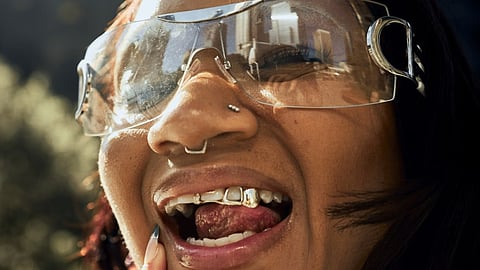 The desire to change one's appearance even extends to the oral cavity, where individuals seek to adorn themselves with tooth gems, and teeth grillz. (Unsplash)