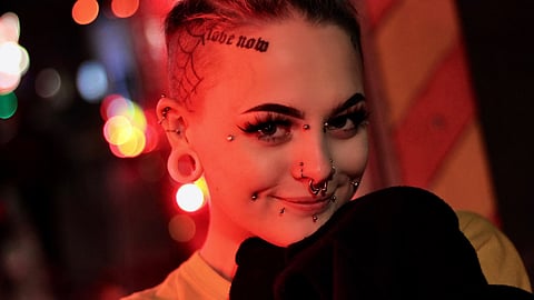 Nowadays, oral piercings and tattoos are recognized as forms of artistic expression and self-expression. (Unsplash)