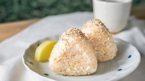 Onigiri: Japanese rice ball snack with various fillings, wrapped in seaweed for convenience. (Representational image: Pixabay)