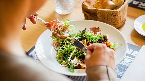 FODMAP-simple restricts only fructans and GOS without restricting other FODMAP groups (polyols, lactose, and fructose), while traditional low FODMAP restricts all five FODMAP groups.