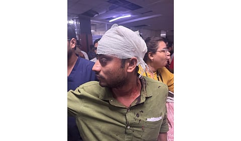Junior resident doctors at LLRM Medical College protest over safety concerns after a colleague was assaulted, leading to the shutdown of key medical services. (Image from X/@Indian__doctor)