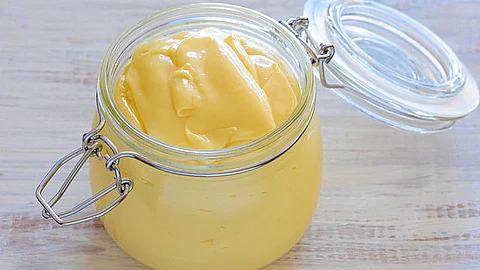 Mayonnaise, commonly referred to as mayo, is a rich and creamy sauce made by combining egg yolks with oil and seasoning with vinegar or lemon juice. (Wikimedia Commons)