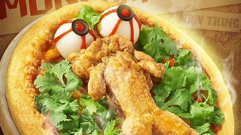 Would you try a pizza topped with a deep-fried bullfrog? Pizza Hut’s bold creation divides netizens. (TwitterX/@jwalkermobile)