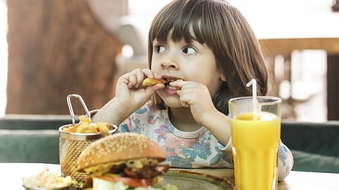 Starting October 2025, new restrictions will prohibit junk food advertisements from airing on television before the 9 pm watershed, as confirmed by regulations unveiled. (Representational Image: Freepik)