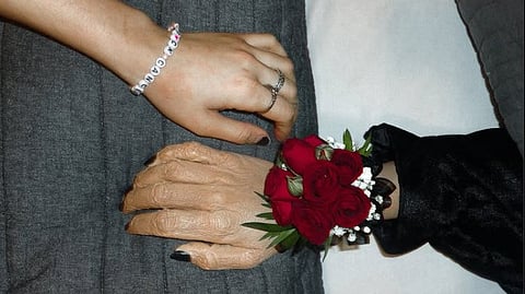A small group of family members, including her friends and boyfriend, joined her at the open-casket funeral of her embalmed amputated arm, which was draped in a grey blanket, a red flower on the wrist, with the fingernails painted black. (Image Credits: Instagram/@semibionicbarbie)