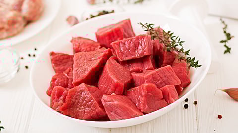 Cubicles of red meat.