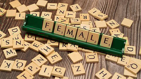 The word 'female' spelled in wooden blocks.