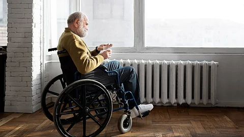 An old person taking medication to manage his symptoms