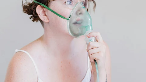A woman undergoing treatment for respiratory disease.