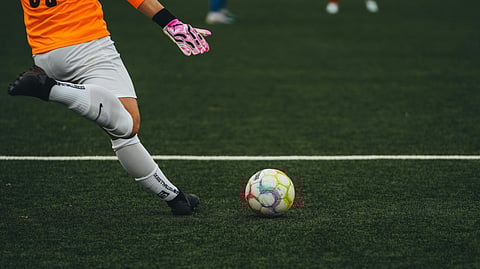 Soccer Goalkeeper Ready to Kick the Ball