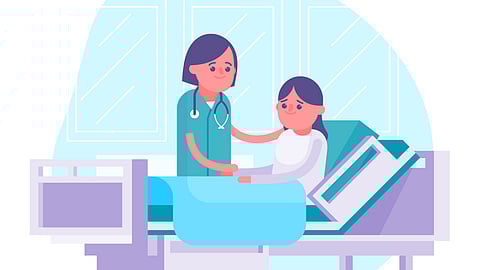 A patient on the bed with doctor offering support.