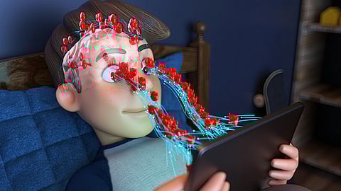 Animation of a boy lying on a bed holding a tablet.