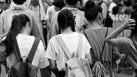 Group of students in a black and white background.