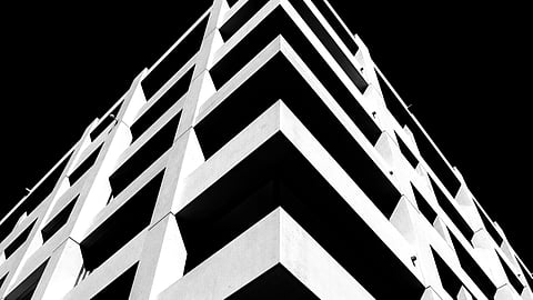 a black and white photo of a tall building