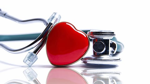 The image shows a stethoscope with heart-shaped chest pieces.