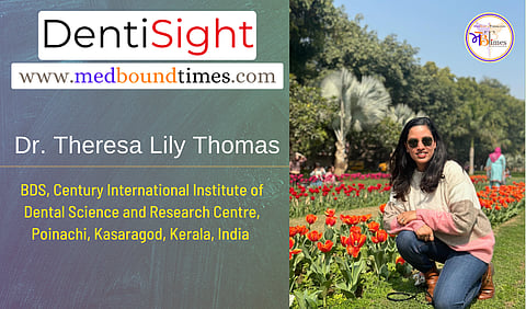 A picture of Dr. Theresa sitting near orange tulips.