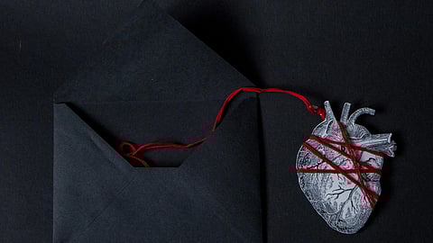 Real Heart Paper Cutout Attached to an Envelope with a String