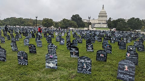 Friends & family who lost loved ones to the overdose crisis placed hundreds of cardboard memorial markers.