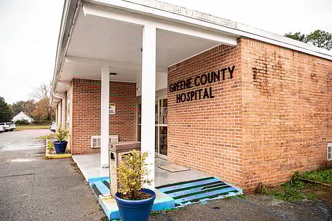 Exterior viewof a brick hospital with a sign reading 'GREENE COUNTY HOSPITAL' above the entrance.